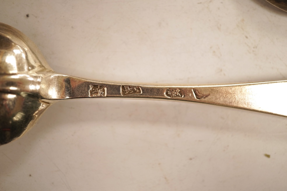 An 18th century Irish? provincial silver Hanoverian pattern tablespoon, maker's mark stamped twice 'I.T with crown above and mullet below' and 'Sterling', 20.9cm, together with eight assorted 18th century silver rat tail
